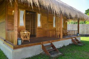 Ein Garten an der Unterkunft Beranda Ecolodge
