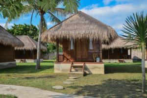 Ein Garten an der Unterkunft Beranda Ecolodge