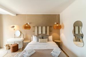 En eller flere senge i et værelse på Rezident Villa Eforie