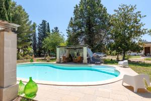 a swimming pool in a yard with a house at Casina San Martino in Uggiano Montefusco +19 photos