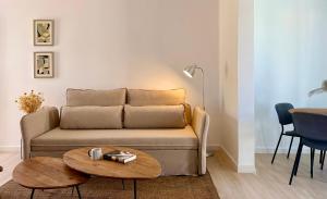 a living room with a couch and a table at Canaryislandshost l Sol in Tías +15 photos