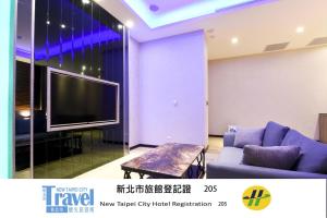 Area soggiorno di Purple Rainbow Motel