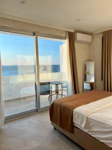 Ένα ή περισσότερα κρεβάτια σε δωμάτιο στο Aporte Hotel Cesme