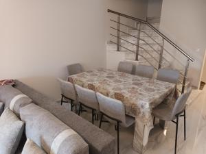 a dining room with a table and chairs at Twins house pool 2 in Nikiti +38 photos