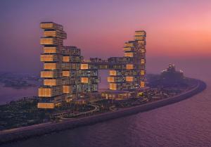 an artist rendering of a tall building with lights on at Atlantis The Royal in Dubai