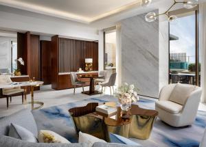 a living room with a couch and a table at Atlantis The Royal in Dubai