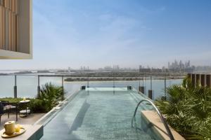 a swimming pool on the roof of a building at Atlantis The Royal in Dubai