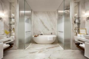 a bathroom with a tub and a glass shower at Atlantis The Royal in Dubai