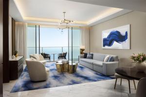 a living room with a couch and a table at Atlantis The Royal in Dubai