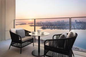 a balcony with a table and chairs and a view at Atlantis The Royal in Dubai