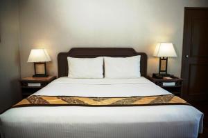 Postel nebo postele na pokoji v ubytování Waterfront Insular Hotel Davao
