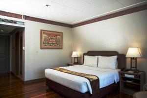 Postel nebo postele na pokoji v ubytování Waterfront Insular Hotel Davao