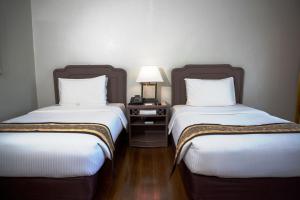 Postel nebo postele na pokoji v ubytování Waterfront Insular Hotel Davao