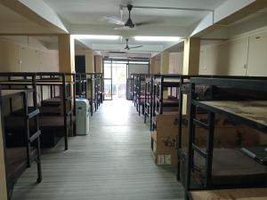 A bed or beds in a room at Yatri Niwas