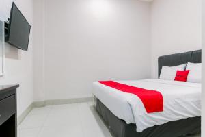 Voodi või voodid majutusasutuse RedDoorz at Seindo Hotel Medan toas