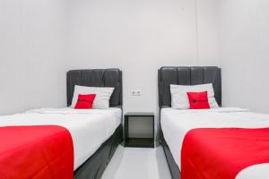 Voodi või voodid majutusasutuse RedDoorz at Seindo Hotel Medan toas