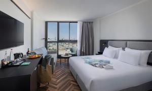 Voodi või voodid majutusasutuse Brown Jerusalem Hotel & Convention Center toas