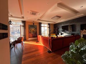 a living room with a couch and a table at Basilica Panorama Luxury in Budapest