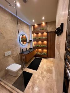 a bathroom with a shower and a toilet and a sink at Basilica Panorama Luxury in Budapest +8 photos
