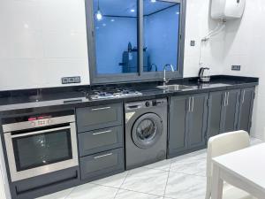 Kuchyň nebo kuchyňský kout v ubytování Appartement Alhoceima