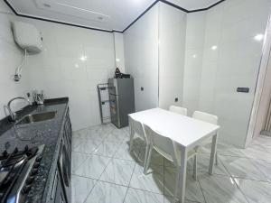 Kuchyň nebo kuchyňský kout v ubytování Appartement Alhoceima