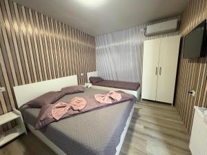 Postel nebo postele na pokoji v ubytování AmA