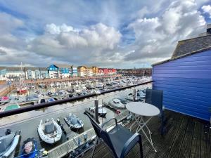 a marina with a bunch of boats in a harbor at Marina View in Exmouth