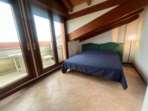 Ένα ή περισσότερα κρεβάτια σε δωμάτιο στο Condominio Vista Mare