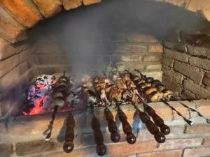a group of food cooking in a brick oven at Сказочный Дилижан in Dilijan