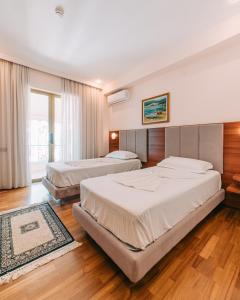 Postel nebo postele na pokoji v ubytování Hotel Kaonia