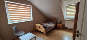 Posteľ alebo postele v izbe v ubytovaní Apartamenty Szkocka