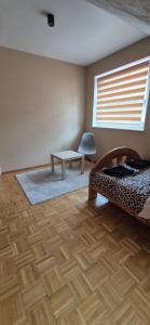 Posteľ alebo postele v izbe v ubytovaní Apartamenty Szkocka