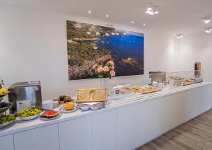 a buffet line with a bunch of food on it at Hotel Ristorante Borgo La Tana in Maratea
