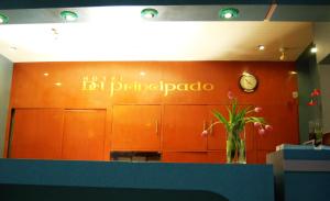 a hotel bat philippato sign on a wall in a room at Hotel del Principado in Mexico City