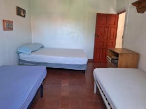 Postel nebo postele na pokoji v ubytování Albergue La Mochila
