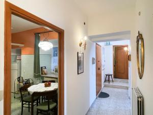 a kitchen and dining room with a table and chairs at Casa Borgo in Montasola
