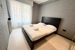 a bedroom with a bed with two towels on it at Antibes hyper center - 4 people - close to shops and beaches in Antibes