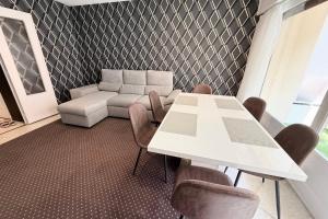 a living room with a table and a couch at Antibes hyper center - 4 people - close to shops and beaches in Antibes