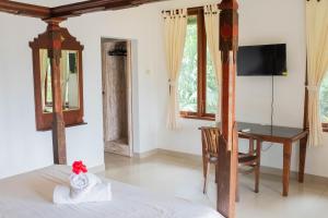 TV a/nebo společenská místnost v ubytování Bramasa Ubud Guest House