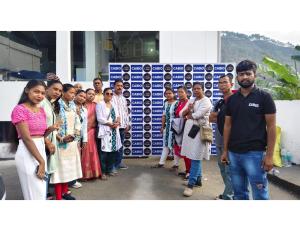 a group of people standing in front of a wall at casbio hotels in Rudraprayāg