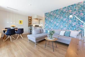 a living room with a couch and a table at Haus Dieksee Holm Dieksee-Idyll in Gremsmühlen +30 photos