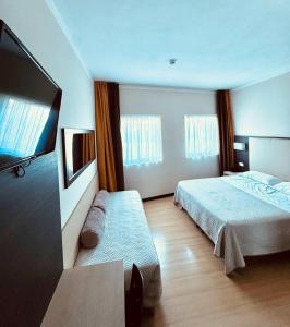 Postel nebo postele na pokoji v ubytování Hotel Alverì