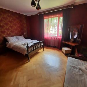 A bed or beds in a room at GIO-NIKA