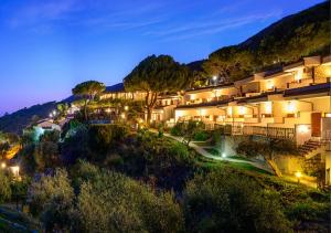 an image of a hotel at night at Hotel Baia Imperiale in Campo nell'Elba