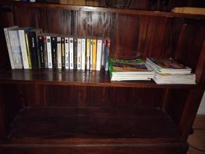 a book shelf with a bunch of books on it at Maison dans plus beau village de France in Sainte-Suzanne