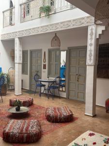 a room with a table and chairs and a table and chairs at Riad Dar Chadia in Marrakesh