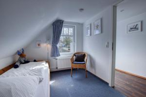 Ein Bett oder Betten in einem Zimmer der Unterkunft Landhaus am Ufer - Wohnung 4