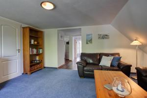 Ein Sitzbereich in der Unterkunft Landhaus am Ufer - Wohnung 4