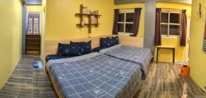 A bed or beds in a room at Ye Yin No84