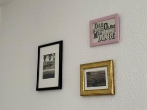 three pictures are hanging on a wall at Vergissmeinnicht - Das Haus in Kurort Oberwiesenthal